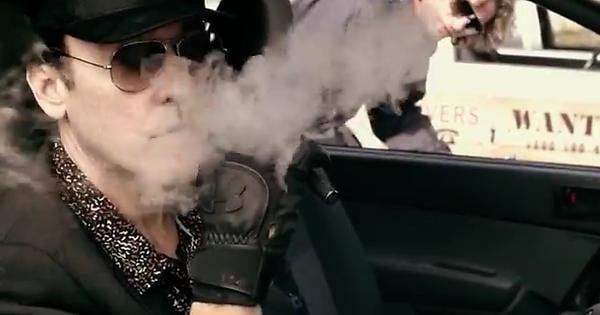 john cusack spotted vaping clouds in the trailer for 'drive hard